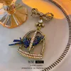 Brooches Oversized BLUE CRYSTAL COCKATOO In BIRD CAGE BROOCH Brass Rhinestone Bow Pin