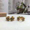 Mode New Ear Stud Grekland slingrande mönster Porträtt skulptur beroende kvinnor män la Medusa Greca Hoop örhängen gulddesigner smycken Vere-84 ringar