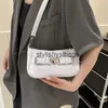 Sacs à bandoulière Sacs à main Sac à bandoulière en cuir verni pour l'été des femmes nouveau sac à main à serrure coeur entièrement en pierre 2023stylishyslbags