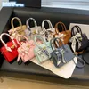 Bolsas de ombro femininas por atacado de fábrica 2 elegantes bolsas clássicas de lichia doce pequena bolsa de fita de arco fresco este ano popular bolsa de couro de cor sólida 9988 #