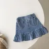 Kjolar flickor baby sommar halvlängd denim kjol set barns väska höft kjol fisktail kjol kortärmad t-shirt tvådelar set 230403