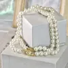 Desginer vivienenn Westwoods Empress Dowager Saturn Full Diamond Magnetic Buckle Double Layer Pearl Necklace Womens High Sense Planet Pearl Neckchain Co