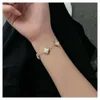Luxury Designer Clover bracelet 2024 New Clover Gold Bracelet Colorless Titanium Reversible Noble Niche Design Ladies Gift