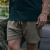 Roupas de ginástica no verão shorts de corredor de correntes de homens casuais de cor sólida e lacta de linho de linho