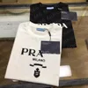 Pradt-shirt Verão Mens Designer Tees Casual Homem Mulheres Soltas Adicione Algodão EUA Tamanho S-XXXXL T-shirt com Letras Imprimir Mangas Curtas Top Venda Luxo Homens Camiseta 643