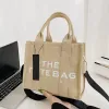 Designer handväska kvinnor herr mode ögonblicksbild kyla den tyga påse lyxhelgen reser shoppare pochette strandsäckar koppling axel bagage nylon kors kropp dukväskor