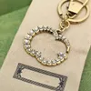 Multi estilo carta llavero moda Flash diamante perla estilo elegante bolso mochila colgante accesorios para hombres y mujeres
