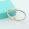 T Bangle Itys hoefijzervormig titanium staal rosé gouden armband sieraden itanium