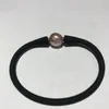 Strand Natural White Purple Freshwater Pearl med kärnbildad barockstorlek cirka 11-12 mm gummiarmband 7,5 "