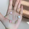 Clover Bracelet Korean version simple fashion pink shell slightly inlaid with four leaf clover women's bracelet light luxury high sense niche sweet early summer