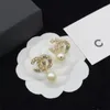 Orecchini di marca di lusso Orecchini alla moda con perle di diamanti Orecchini in oro 18 carati Orecchini di design in acciaio al titanio di alta qualità