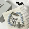 Viviene Westwoods Designer Jewelry Empress Dowager Xis neues blaues Perlen-Saturn-Armband mit individuellem Nischendesign, vielseitig und voller Diamant-Planetenperlen