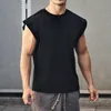 T-shirt da uomo Palestre Bodybuilding Camicie slim senza maniche O-collo Maniche in cotone T-shirt Abbigliamento Uomo Estate Allenamento Fitness T-shirt di marca 230404