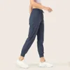 Koşma ve fitness trendinde çekilişli gündelik pantolonlarla kızların yaz tozlukları için hızlı kurutma havalı spor pantolonları