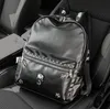 Outlet Men Shoulder Bag Street Persoonlijkheid Ghosthoofd Decoratie Punk Backpacks College Wind Rivet Student Backpack Large-capaciteit Gevotte lederen computerzak met grote capaciteit