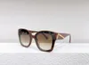 Kvinnors solglasögon för kvinnor män solglasögon herr mode stil skyddar ögonen UV400 -objektiv med slumpmässig låda och fall 40098 33