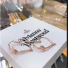 Viviane Designer Jewelry New Viviennes Westwood Western Vivieene Westwood Love Гладкие серьги для лица маленькие и сладкие большой круги персич -сердце Saturn Hollow серьги