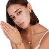 Bijoux de créateurs Chinois Explosif Highlight Blanc Perle Bracelet Ensemble Niche Polyvalent Or Titane Acier Papillon Pendentif Colliers La Nouvelle Annonce