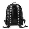 Outlet Men Shoulder Bag Street Persoonlijkheid Ghosthoofd Decoratie Punk Backpacks College Wind Rivet Student Backpack Large-capaciteit Gevotte lederen computerzak met grote capaciteit