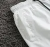 Pantalones cortos de hombre Pantalones cortos de diseñador Traje de baño Trajes de baño de playa Ropa de calle de moda de verano en blanco y negro Traje de baño de secado rápido Pantalones de playa de tablero impreso M-3XL