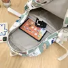 Schultaschen Mädchen Hohe Kapazität Nylon Drucktasche Damen Niedliche Cartoon-Muster Laptop Mode Weibliche Reise College Rucksack Frauen