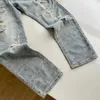 Jeans da uomo Streetwear per uomo Pantaloni con stampa di lettere alla moda Hip Hop Pantaloni in denim maschili tinta unita strappati taglia asiatica M-XXL