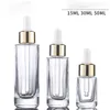 Bottiglie di vetro trasparente spesso di forma quadrata da 15 ml 30 ml 50 ml con contagocce per essenza di lozione con tappo in argento dorato