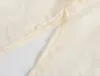 Blouses pour femmes KEYANKETIAN Printemps Design de mode Sense Slim Silhouette Mince Cardigan Chemise Cordon Longueur Moyenne Haut Translucide