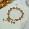 Charmarmbanden aankomst in Zuid -Korea Fashion Tassel Micro ingelegde zirkon Natural Strawberry Quartz Bead Bracelet Dames voortreffelijke sieraden YBR637 230406