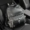 Men shoulder bags street personality ghost head decoration punk backpacks college wind rivet student backpack large-capacity padded leather computer bag 3789#