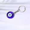 Nyckelringar lanyards l Evil Eye Keychain nyckelring för kvinnor män bil lycka till lycklig charm skydd diy kedjor släpp leverans amigk