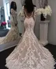 Nieuwe illusie lange mouw Lace Mermaid Trouwjurken TULLE Applique Court Princess Wedding Bruidsjurken met knopen