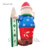 Wonderful Giant Surfing Inflatable Santa Claus Model Advertising Airblown Santa Balloon Holding A Surfboard for Outdoor Christmas Decoration