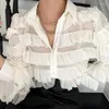 女性のTシャツ女性セクシーな長袖シングル胸部トップカジュアルラペルゆるいステッチケーキランタン非対称裾