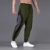 Pantaloni da uomo Europa e Stati Uniti Pantaloni sportivi Pantaloni da fitness da uomo di grandi dimensioni Quick Dry Running Training Color Men Loose Bomb 231107