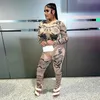 Kvinnors tvåbitar byxor Fashion Print Sexig kvinnlig träning Se genom 2 Set Hipster Crop Tops Leggings Stretch Streetwear Matching Suit 231107