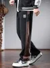 メンズパンツバギーストレートコーデュロイメンズ秋のファッションサイドストライプブラックエラスティックウエストドローストリングジョギングズボン