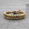 Braccialetti con ciondoli Bracciale stile campeggio esterno Uomo Paracord Corda per paracadute Polsino Bracciale regolabile Homme Gioielli intrecciati fatti a mano