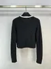 女性のセーター黒と白のパッチワークプルオーバーボウファッション2023