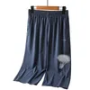 Herr shorts män shorts elastiska sju punkt shorts sommarbockar kläder nylon svart grå spandex svett w0412