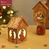 Décorations de Noël Ornements de petite maison en bois dans la neige rougeoyante