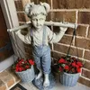 庭の装飾彫像樹脂装飾フェリシティヤードの彫刻のための小さな女の子の花屋外テーブルトップ飾り