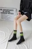 Femmes chaussettes coton mode corée Harajuku rue Hip Hop planche à roulettes rayé milieu Tube noir blanc couleur respirant sport