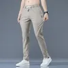 Herrbyxor Chino fritidsbyxor herr koreanska tunna klassiska sommarbyxor elastisk midja mode khaki svart resår lätta herrbyxor 230407