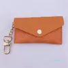Unisex nyckelpåse läderhållare solid färgväska designer mode kvinnor mens kreditkortshållare mynt