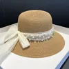 トレンディパールストローハットメッシュサンシェードハット夏の女性弓保護帽子海辺の漁師盆地帽子