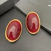 Ryggar örhängen modeöverdrivning enkel atmosfärisk oval retro stil rött örhänge klipp