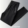 Pantaloni da uomo Pantaloni dritti elastici in puro colore Pantaloni sportivi da jogging Stile quattro stagioni Moda casual lunghi