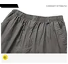 Herrbyxor knä längd last shorts män sommar avslappnad bomull multi ficka capri byxor taktisk militär plus storlek 6xl