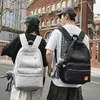 Sac à dos couleur unie multi-compartiments grande capacité tendance de rue étudiant et couple épaule homme/femme